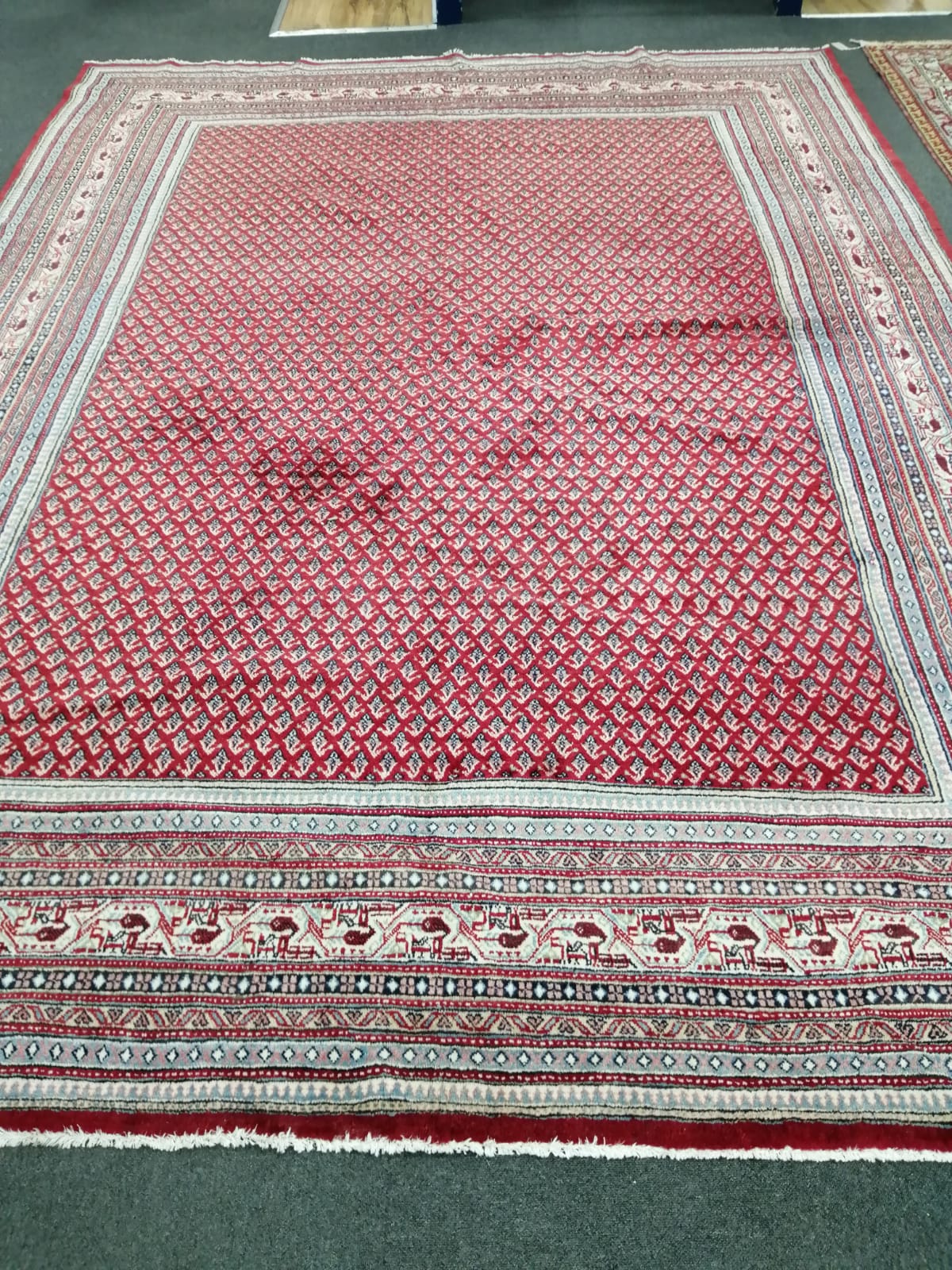 A North West Persian red ground carpet, 366 x 272cm